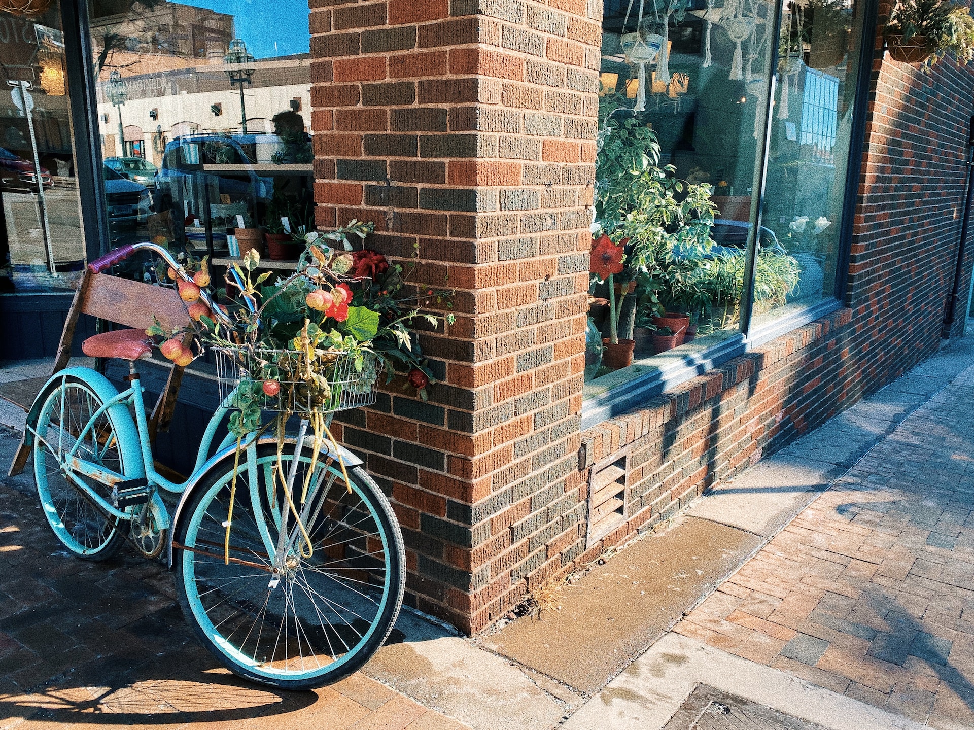 downtown flower shop with blue bike parked outside