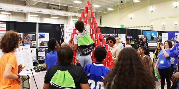 MI Career Quest 8th-grade students stack cups for an American Institute of Architects interactive activity