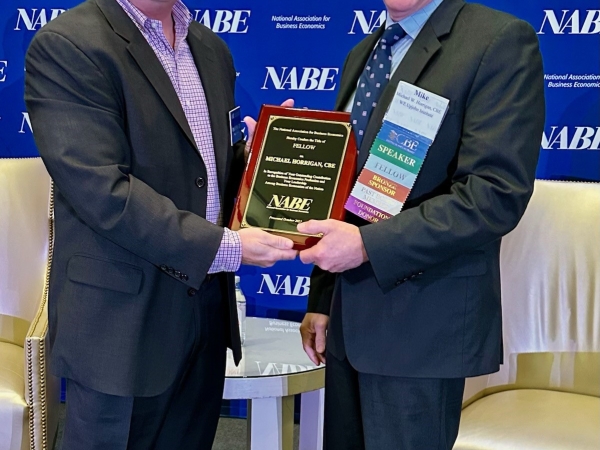Michael Horrigan receives NABE fellowship plaque from NABE Executive Director Tom Beers