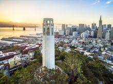 San Francisco Coit Tower Telegraph Hill and city and Bay bridge behind